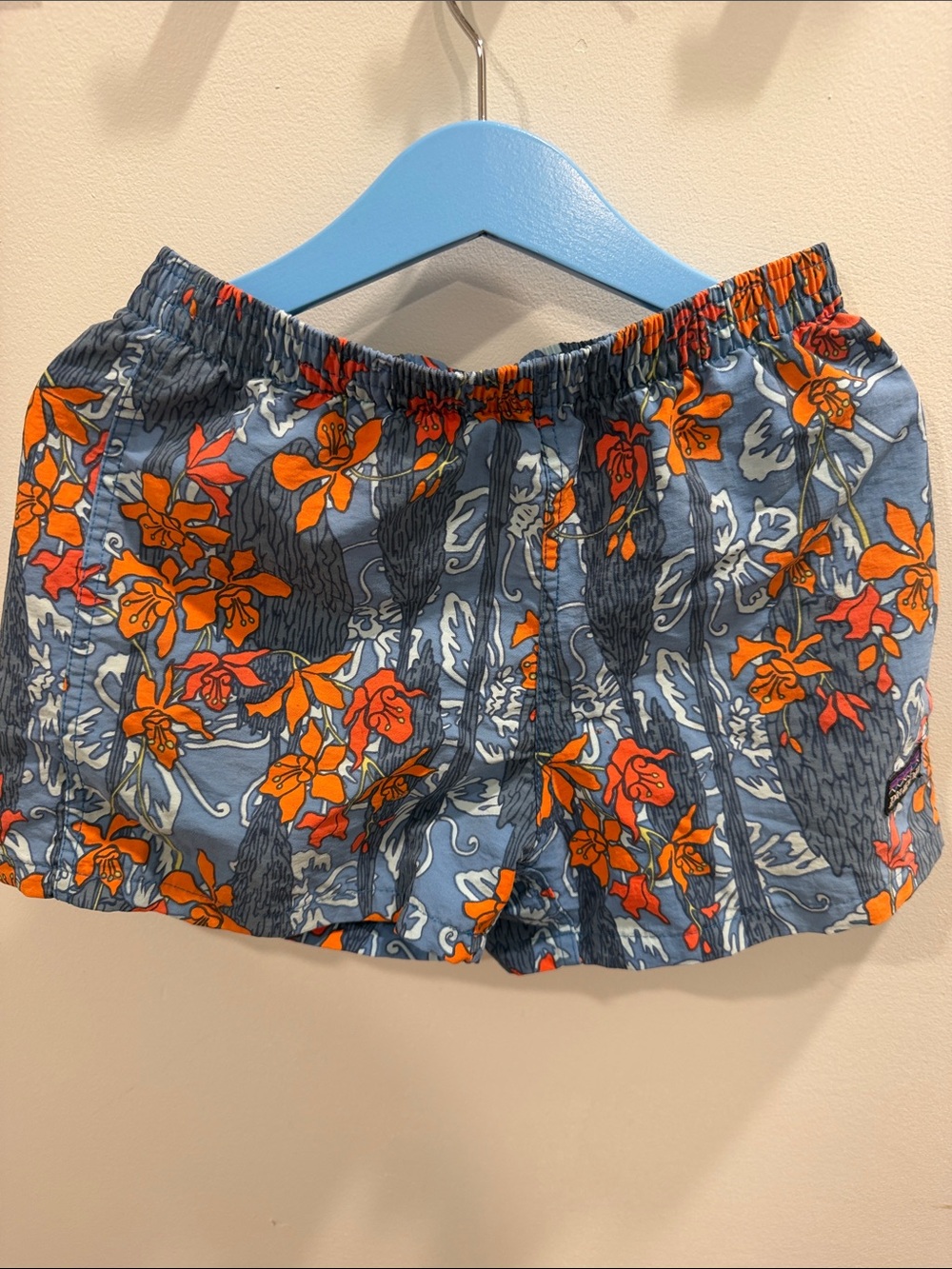 Patagonia Kids Blue Swim Trunks with Orange Floral Print